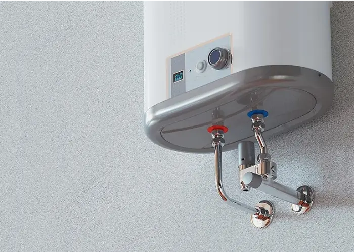 A tankless water heater is mounted on a wall.